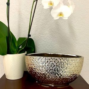 Silver toned  oval shaped shallow vase with flower embossed design